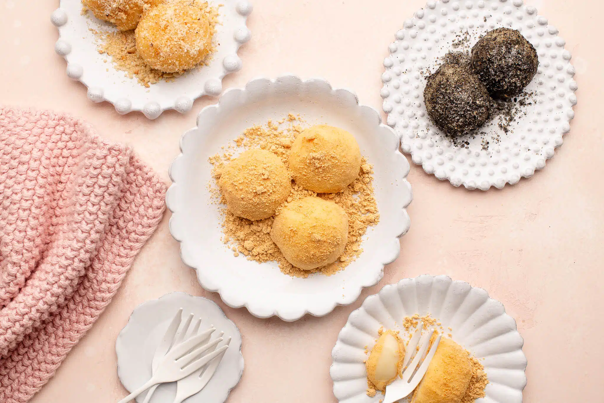 peanut mochi and black sesame mochi on white plates