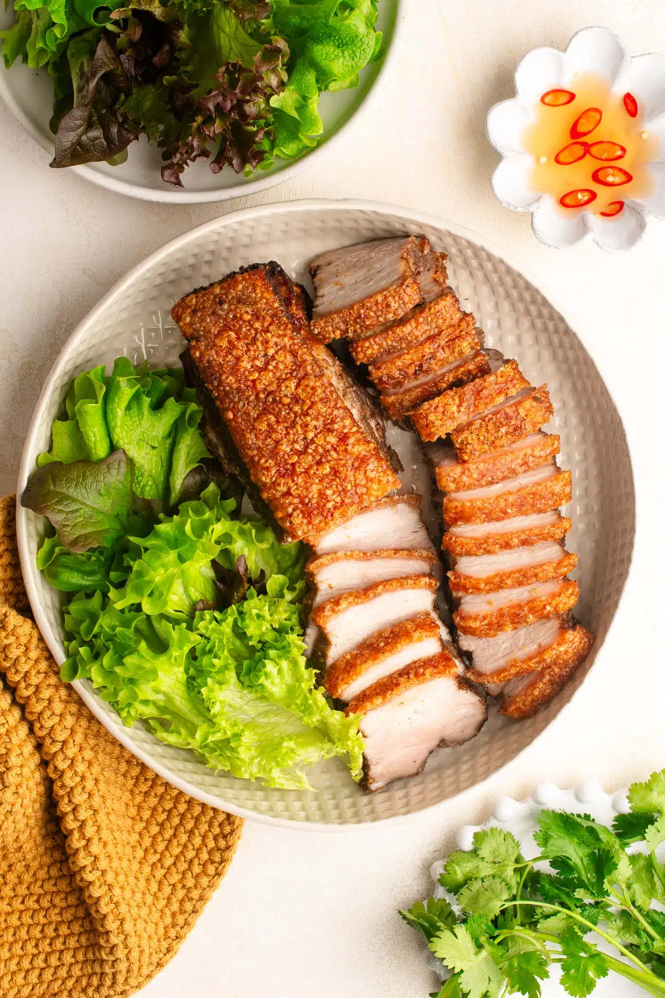 sliced air fryer crispy pork belly with salad
